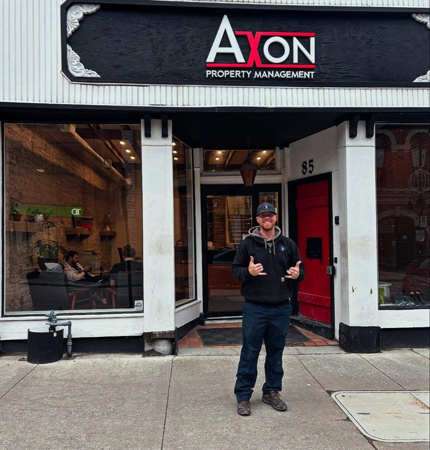 Brock outside Axon Property Management on Princess Street