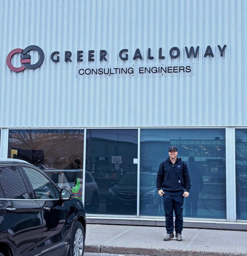 Brock outside the Greer Galloway consulting engineers office