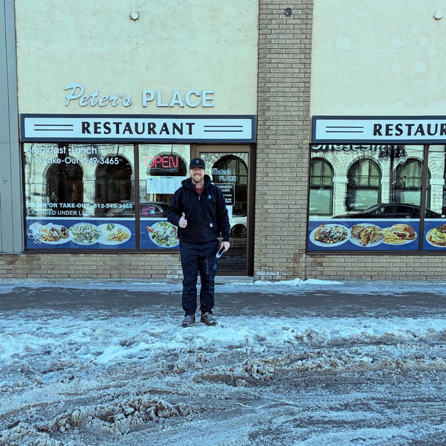 Brock outside Peter's Place Restaurant on a snowy morning
