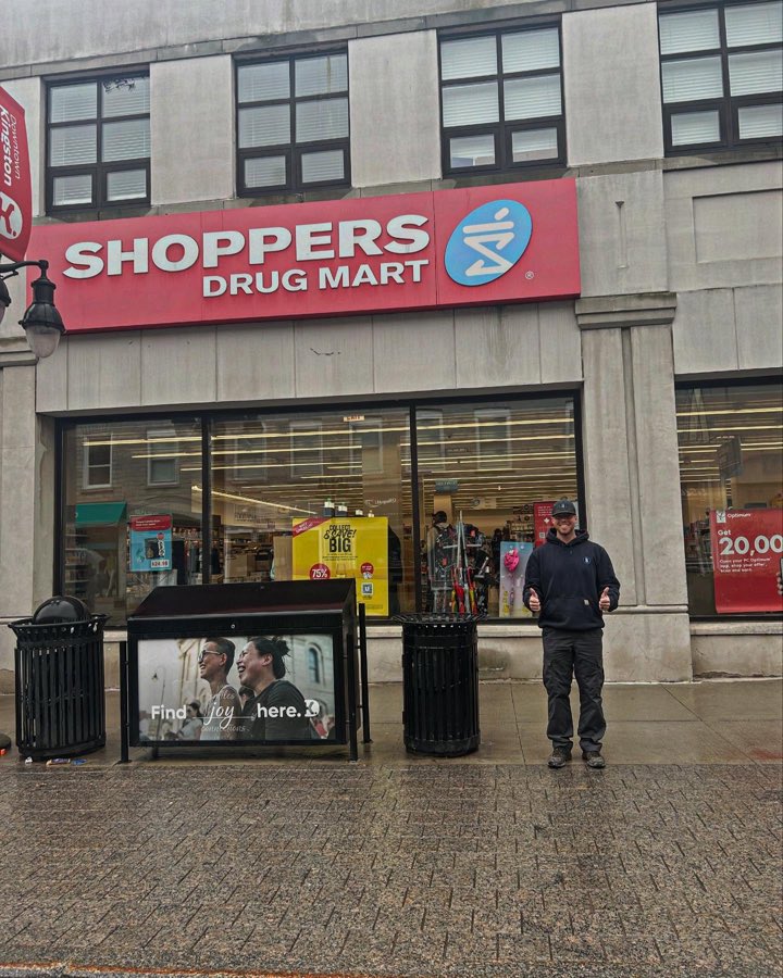 Brock outside the Shoppers Drug Mart in downtown Kingston