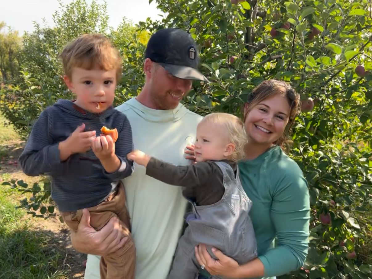 Brock Cook with his wife and their two young sons out apple picking, the family behind TakeAway & Recycle